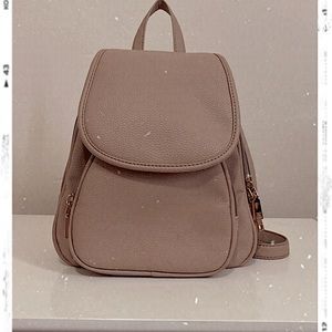 I am selling does light brown small book-bag